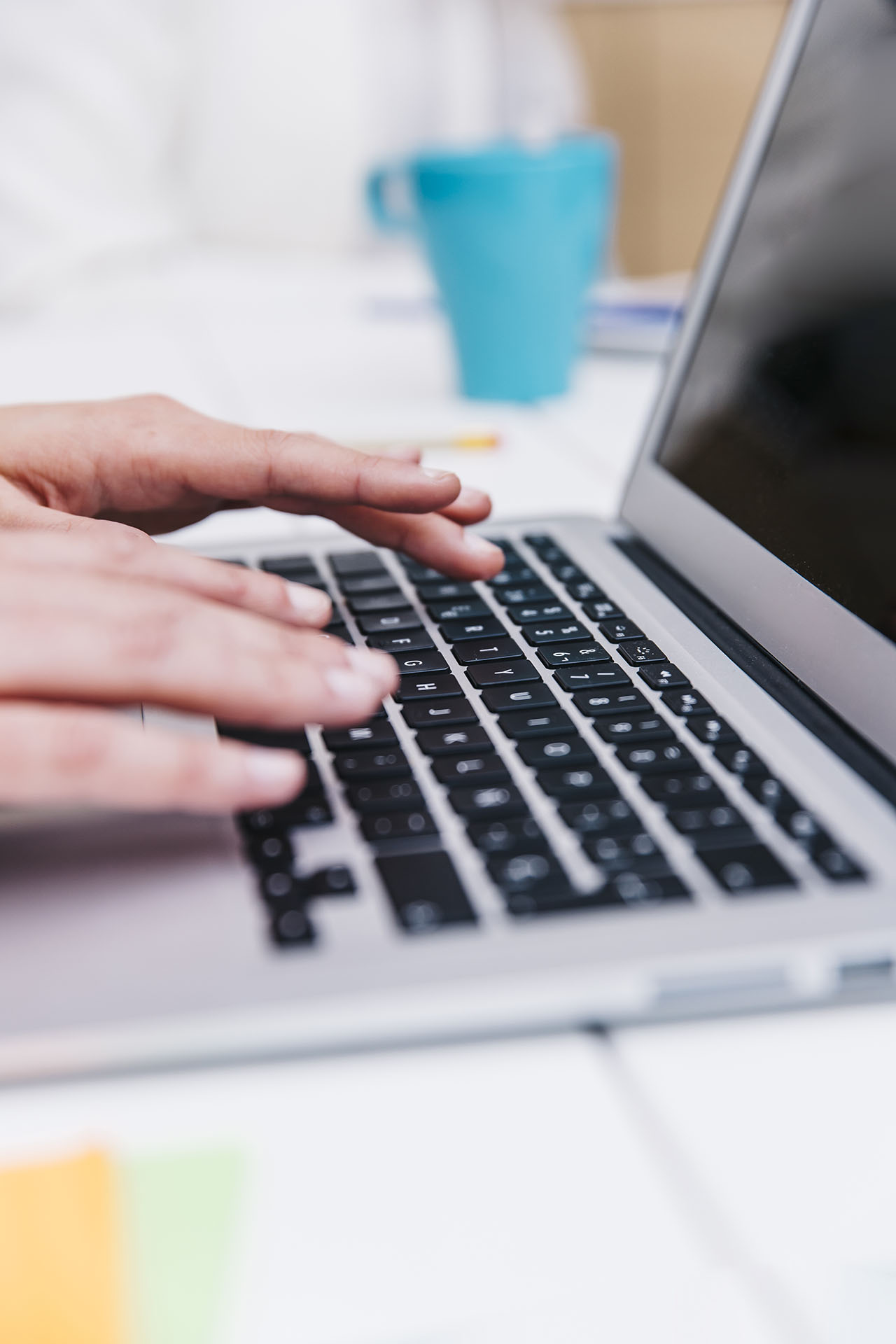 fingers-typing-laptop-close-up